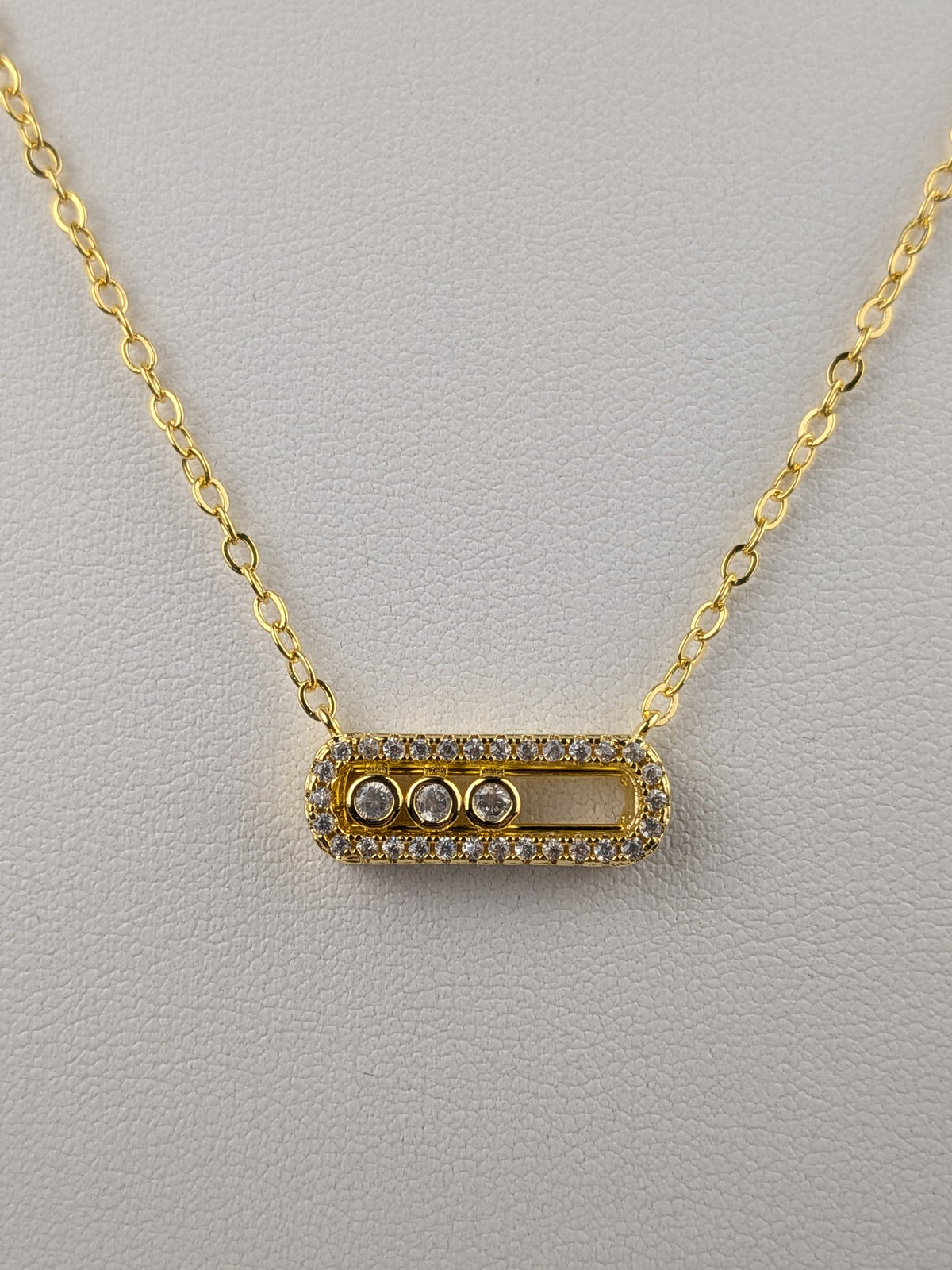 Cadena Rolón + Dije MK Circón Oro Laminado